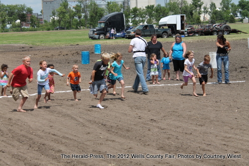 Kids racing for tickets for rides 2 Image
