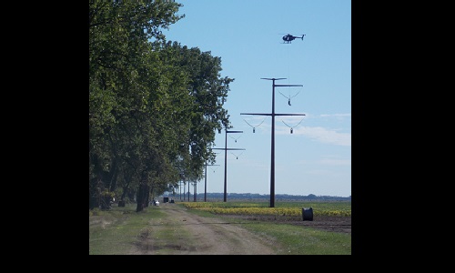 Helicopter setting up for wires Image