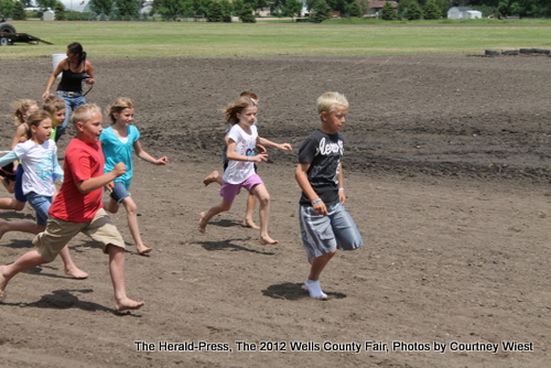 Kids racing for tickets for rides Image