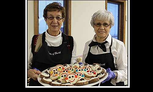 Pearl & Pat share treats at Harvey's Faith Lutheran's Cookie Wal Image